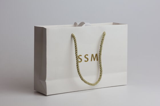 Premium White Textured Specialty Paper Tote Bag with Gold Hot Stamped Lettering and Twisted Rope Handles